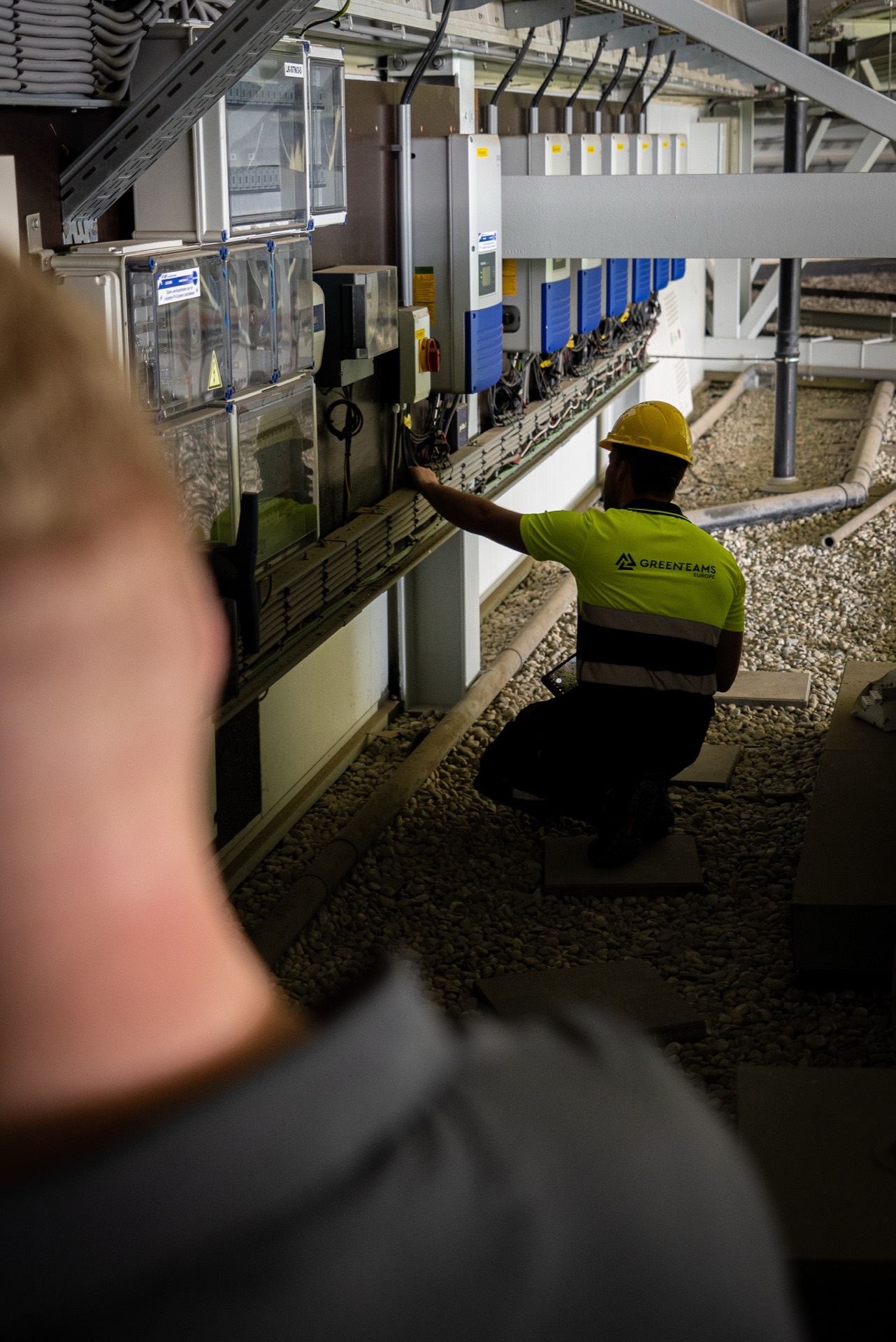 Engineer carrying out electrical work on a solar installation