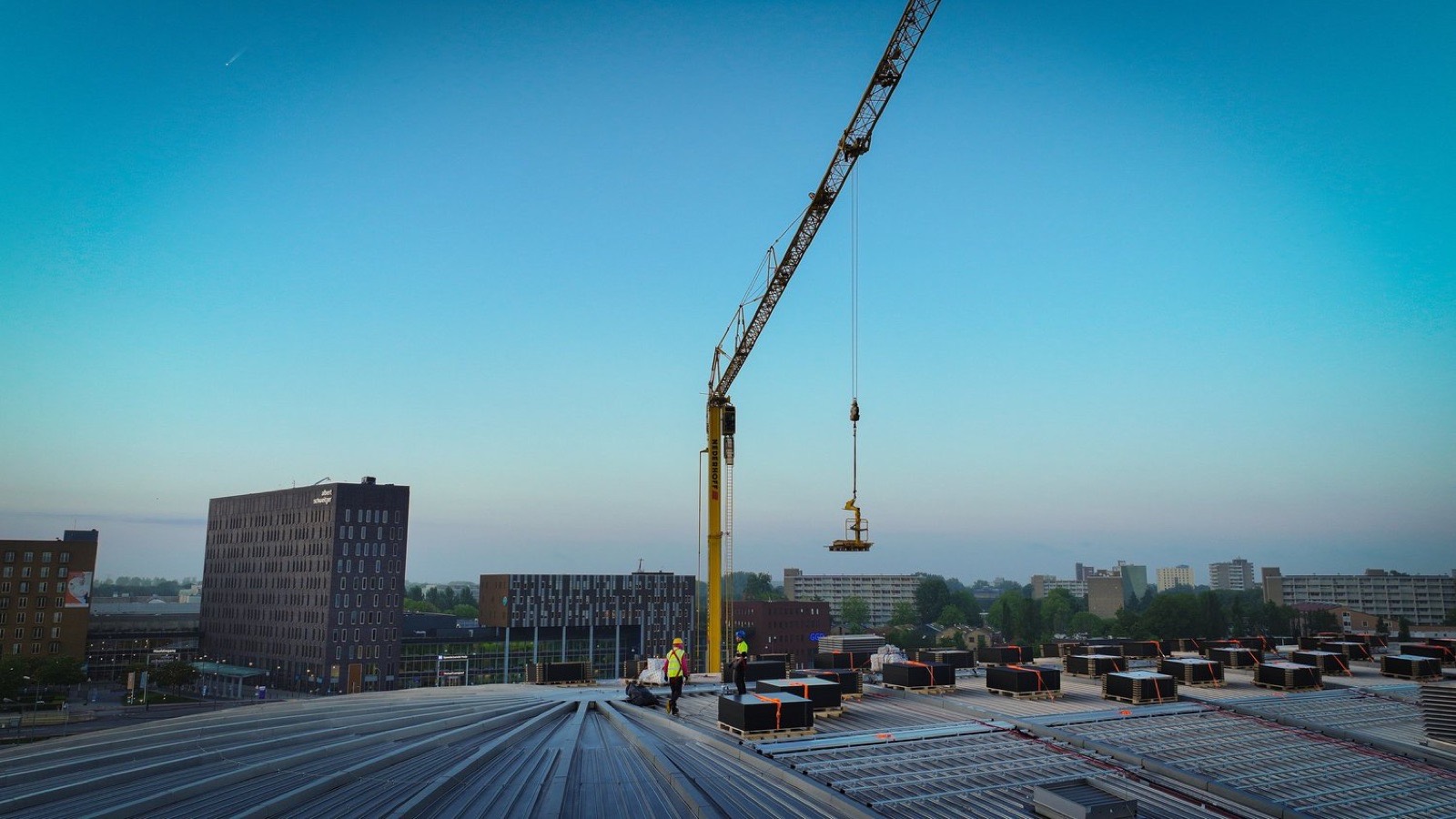 Optisport Dordrecht ice rink curved-roof solar installation